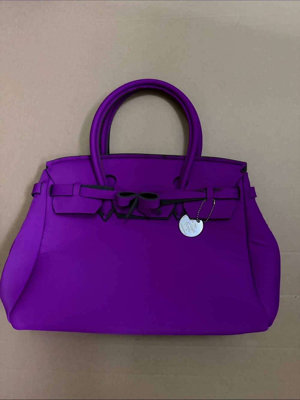 The Capri Bag Purple Structured Handbag with Bow Accent. Made in Italy.